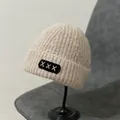 Detail of beige mohair knit beanie featuring a black square patch with white X stitching - M (56-58cm) / XXX Embroidery Patch Style / Pink