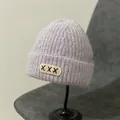 Close-up of light purple mohair knit beanie with folding brim and stitched XXX patch - M (56-58cm) / XXX Embroidery Patch Style / Purple