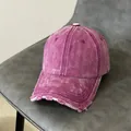 Detailed macro view of washed purple denim baseball cap featuring distressed ripped edges - Adjustable / Purple