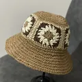 Detailed close-up of handmade crochet raffia bucket hat featuring colorful floral knit pattern - M(56-58cm) / Khaki