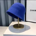 Detail shot of Klein blue knitted bucket hat showing chunky knit texture and bell shape - M (56-58cm) / Blue