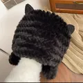 Close-up of black plush cat ear winter hat showing thick furry texture and cozy earflaps - Black