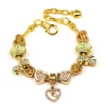 Golden snake chain heart bracelet with yellow glass beads and bow charm on white background - Style 008