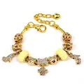 Elegant gold snake chain bracelet with crystal rose, crown, and paw charms for women - Style 007