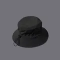 Detail of waterproof bucket hat showing adjustable elastic drawstring and plastic toggle - M (56-58cm) / Black