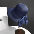 Navy blue woven straw sun hat for summer featuring a stylish large side bow decoration - M (56-58cm) / Navy Blue