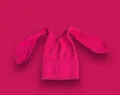 Close-up of rose red knitted beanie featuring long bunny ears and ribbed texture - Rose Red