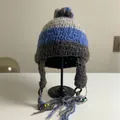 Handmade striped knit trapper hat with pompom and beaded tassels on display stand - M (56-58cm) / Blue Grey