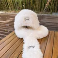 Detail of white plush trapper hat with rabbit ears and freedom label on wooden bench - M (56-58cm) / White