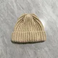Detailed close-up of thick beige cable knit beanie showing warm fluffy wool texture - M (56-58cm) / Khaki