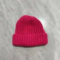 Detail of rose red chunky knit beanie with thick ribbed texture and wide folded brim - M (56-58cm) / Rose Red