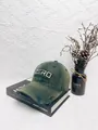 Detailed close-up of olive green distressed baseball cap with white ZERO embroidery - M (56-58cm) / Green