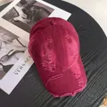 Close-up of distressed burgundy cotton baseball cap with ripped details on brim - M / Burgundy