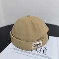 Macro detail of khaki brimless docker hat showing nylon grid texture and camping label - M(56-58cm) / Khaki