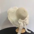 Straw sun hat with white organza wavy brim and delicate lace bow for summer travel - M (56-58cm) / Beige