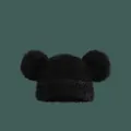 Detailed close-up of fluffy black knit beanie with soft plush texture and large pom-pom ears - M (56-58cm) / Black