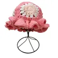 Detailed crochet texture of pink handmade sun hat featuring floral knit and ruffled brim - M / Pink with White Flower