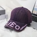 Detailed close-up of dark purple denim baseball cap with leather letter embroidery on brim - M(56-58cm) / Purple