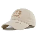 Close-up of distressed brim and 3D embroidery on a vintage style baseball cap - M (56-58cm) / Beige