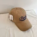 Detailed shot of khaki cotton baseball cap featuring blue letter embroidery and white tags - M (56-58cm) / Khaki