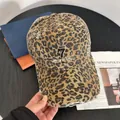 Close-up of leopard print baseball cap featuring embroidery and distressed details - M(56-58cm) / Khaki Leopard