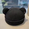 Detail view of black beanie with cat ears and silver metal ring accessory - M (56-58cm) / Black