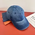 Detailed texture of navy blue washed denim baseball cap with vintage distressed finish - M (56-58cm) / Dark Blue