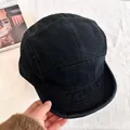 Detail of a black five-panel camper hat featuring a vintage short brim and twill texture - M (56-58cm) / Black