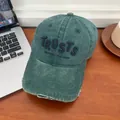 Close-up of distressed vintage dark green baseball cap with purple letter embroidery - M (56-58cm) / Dark Green