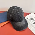 Macro view of charcoal gray washed denim baseball cap with vintage distressed texture - M (56-58cm) / Black