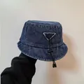 Donkerblauwe denim vissershoed met asymmetrische rand en verstelbaar trekkoord voor dames - M / Donkerblauw