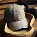 Vintage washed cotton baseball cap in olive green featuring white H letter embroidery - M (56-58cm) / Camel