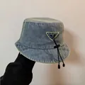 Blauwe denim vissershoed met verstelbaar trekkoord en driehoekige patch op de zijkant - M / Lichtblauw