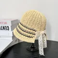 Beige woven straw bucket hat with black stripes and a large white lace flower bow decoration - M(56-58cm) / Beige with Black Stripes