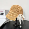 Summer straw bucket hat with white lace bow and stripes on a minimal display stand - M(56-58cm) / Khaki