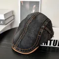 Detail of vintage black denim flat cap with orange stitching and leather brim on wood - M (56-58cm) / Black
