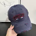 Close-up of vintage navy baseball cap with 3D embroidery and distressed ripped details - M (56-58cm) / Navy Blue