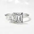 Macro detail of S925 silver ring featuring pear and emerald cut cubic zirconia stones - US 5 / White
