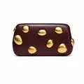 Detail view of burgundy leather clutch with irregular polished gold metal pebbles - Wine Red With Double-Sided Studs