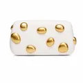 Detail of white evening clutch featuring polished gold pebble-shaped metal embellishments - White With Double-Sided Studs