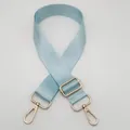 Detail of light blue adjustable nylon strap with gold metal lobster clasps and twill texture - Light Blue