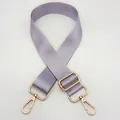Detail of adjustable purple nylon bag strap with gold metal lobster clasps and buckle - Light Purple