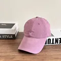 Detail of lavender cotton baseball cap with white M letter embroidery on wooden table - M (56-58cm) / Pink