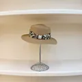 Detailed macro view of straw hat with leopard print ribbon and elegant pearl buckle - M(56-58cm) / Khaki