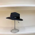 Close-up of black woven straw sun hat with wide satin ribbon and metal plate detail - M (56-58cm) / Black