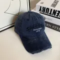 Close-up of distressed denim baseball cap with 3D embroidery and vintage worn brim - M (56-58cm) / Navy Blue