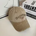 Detail of vintage khaki cotton baseball cap with distressed brim and 3D letter embroidery - M (56-58cm) / Khaki