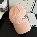 Side view of pink distressed baseball cap with black letter embroidery on cotton fabric - M (56-58cm) / Pink