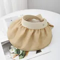 Detail of beige sun visor featuring large floral pattern and elegant bow decoration - M (56-58cm) / Earthy Yellow