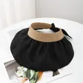 Detail view of khaki straw sun visor with black wide brim, ribbon bow and metal plaque - M (56-58cm) / Black